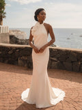Abito da sposa modello Perla in crepè avorio mezza sirena con scollo all'americana e fiori staccabili